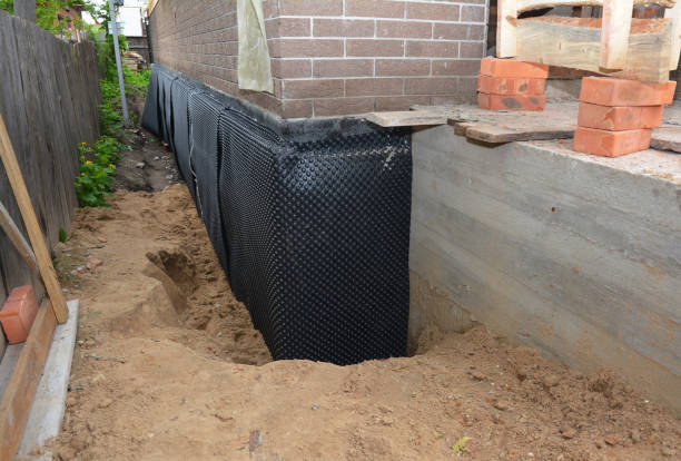 SJ Waterproofing Pros technician performing targeted Exterior Waterproofing assessment in Bay Minette, AL